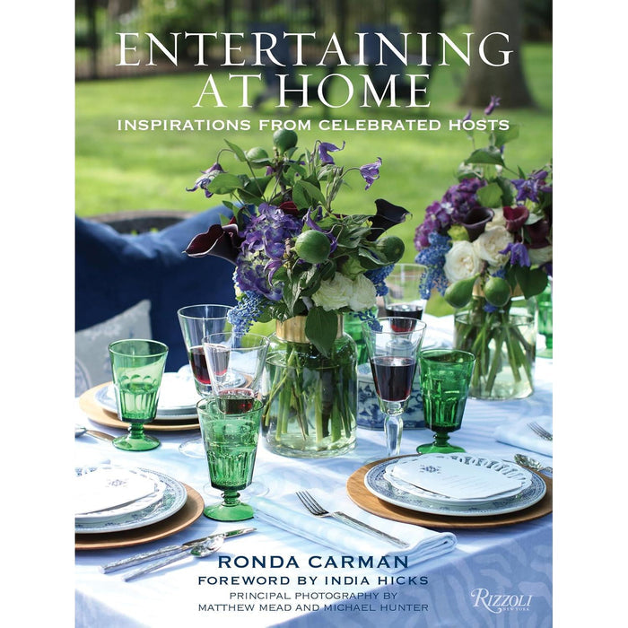 Hardcover book cover featuring an elegant outdoor table setting with floral centerpieces and green glassware.