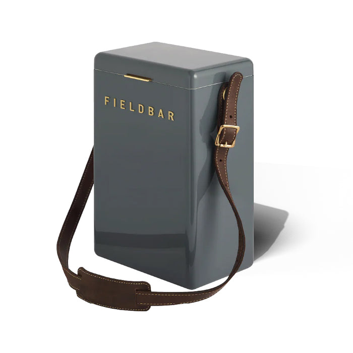 Grey FIELDBAR drinks box with an adjustable brown leather shoulder sling and gold hardware for hands-free carrying.
