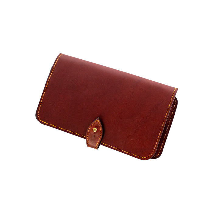 Handcrafted brown vegetable-tanned leather rifle cartridge wallet with a secure cufflink flap closure and contrast stitching.