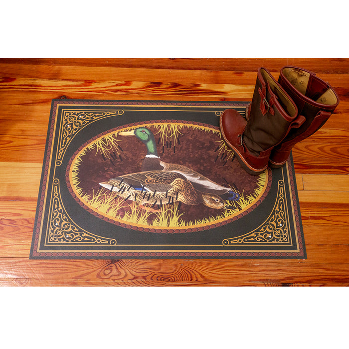 2' x 3' vinyl floor cloth featuring a mallard duck sporting art motif with ornate gold borders on a wooden floor.