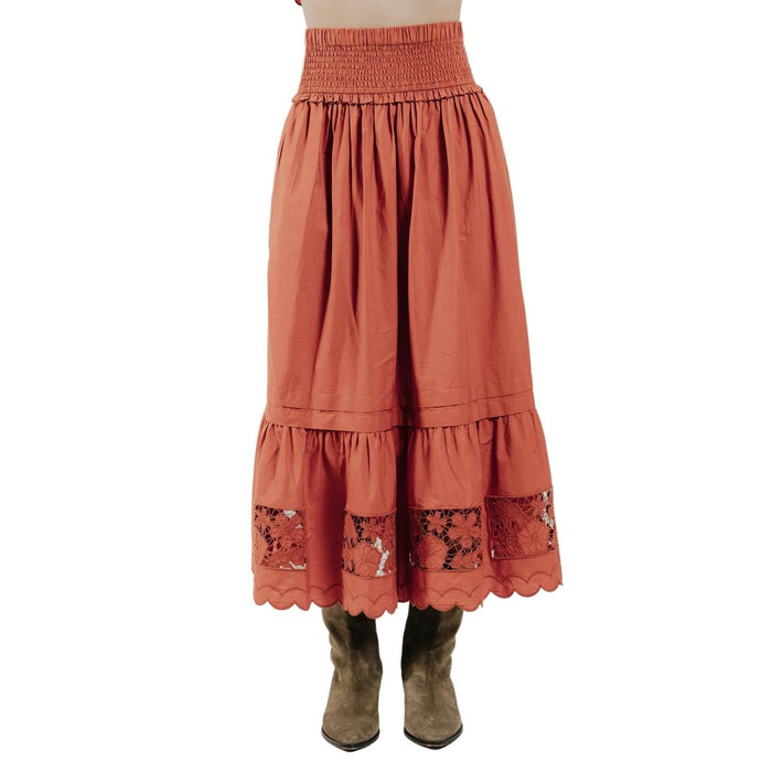 Cinnamon midi skirt in cotton with a smocked waistband, tiered silhouette, floral lace inserts, and a scalloped hem.