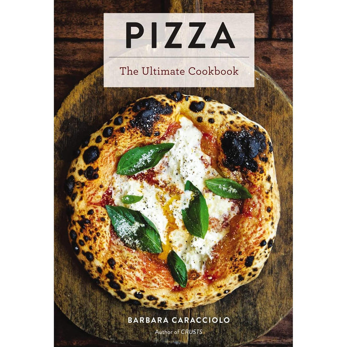 Hardcover cookbook titled Pizza featuring a wood-fired margherita pizza with fresh basil on a rustic wooden board.