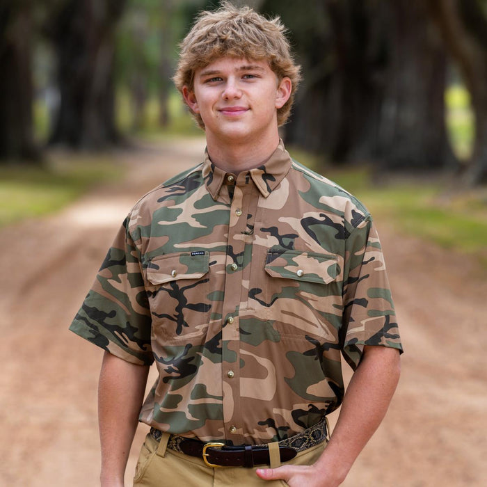 Man wearing a short-sleeve camouflage Cordoba outdoor shirt with button-down front and dual chest pockets.