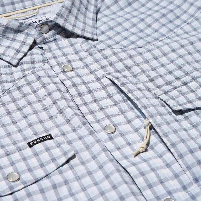 Light blue and white checkered Poncho western shirt with pearl snaps, chest pockets, and a sunglasses loop.