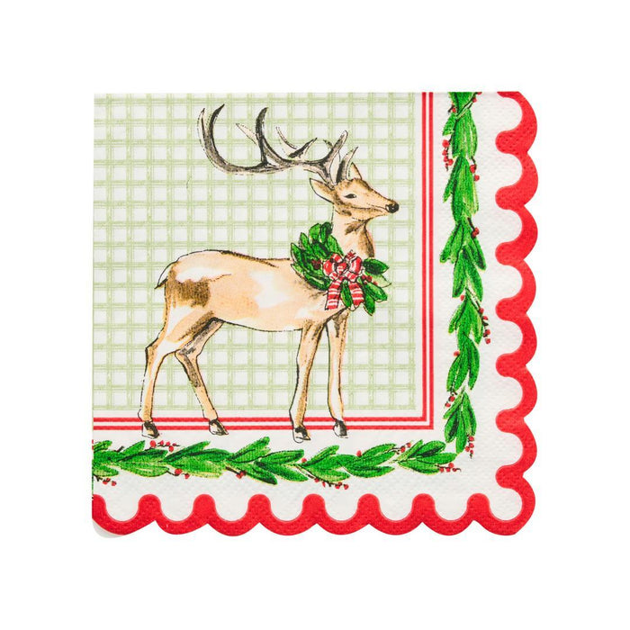 Scalloped 5-inch paper cocktail napkin with a deer illustration, holly garland, and green plaid background.