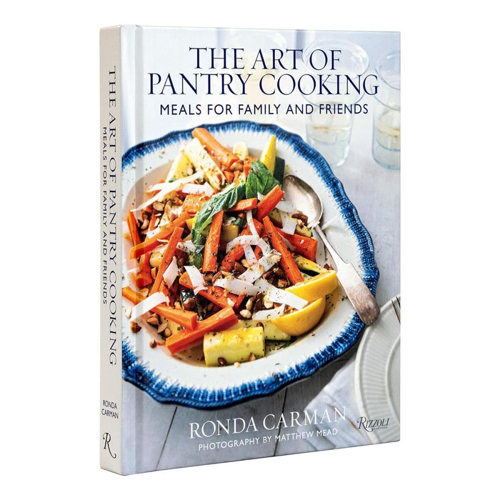 Hardcover cookbook titled The Art of Pantry Cooking featuring a vibrant vegetable dish on a blue and white patterned plate.