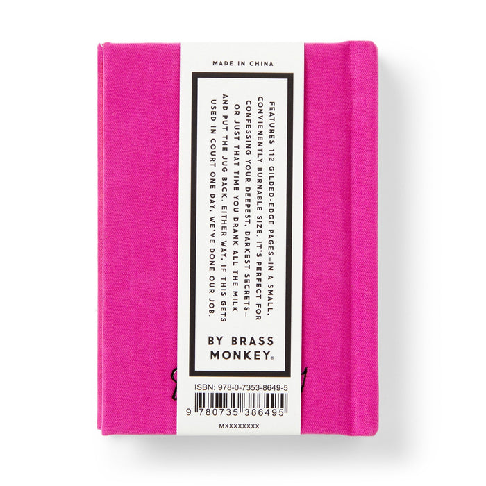 A small, bright pink book titled Tiny Diary for Not So Tiny Secrets by Brass Monkey, with a perfect bound cover and a white and black back label showing the book’s features, barcode, ISBN number, and the Brass Monkey brand.