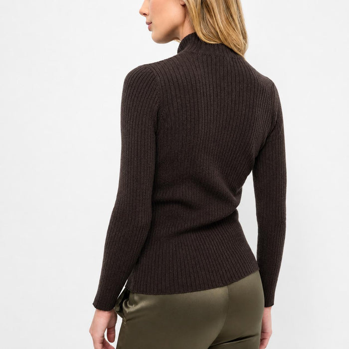 Back view of a slim-fit, dark brown ribbed knit turtleneck sweater with long sleeves on a model.