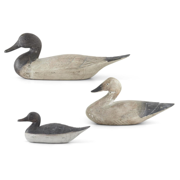 Set of three antique-style resin duck decoys in varying sizes with a weathered gray and cream finish.