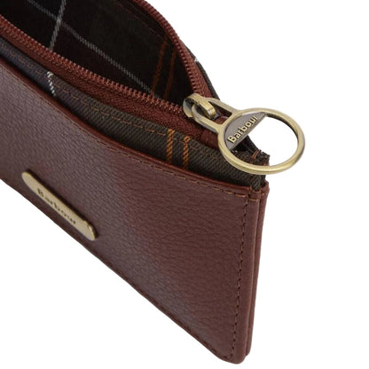 Brown leather Barbour card holder with a gold branded zipper pull, tartan lining, and a matte gold logo plate.
