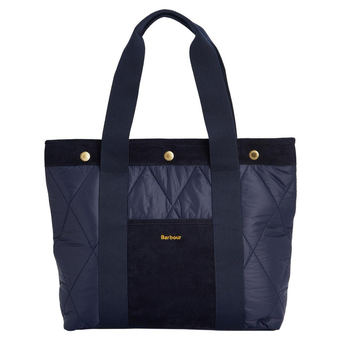 Navy blue Barbour Healy quilted tote bag with corduroy trim, webbed handles, and gold branded snap closures.