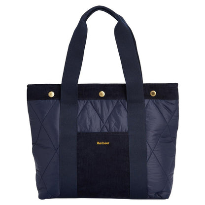 Navy blue Barbour Healy quilted tote bag with corduroy trim, webbed handles, and gold branded snap closures.
