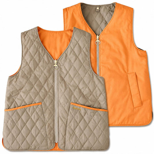 Barbour reversible quilted vest in tan diamond-quilted polyamide and vibrant orange, featuring brass zip hardware.