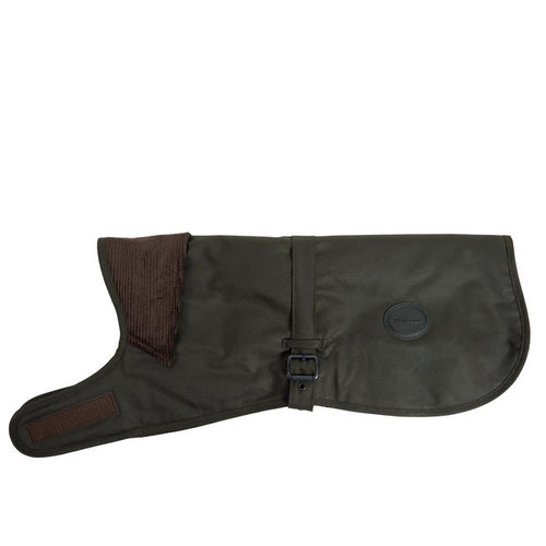Olive green Barbour waxed cotton dog coat with a brown corduroy collar, adjustable buckle strap, and branded logo badge.