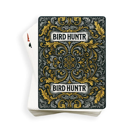 Deck of Bird Hunter playing cards featuring intricate gold and silver filigree artwork on a dark background.