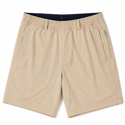 Beige Birddogs 6-inch twill shorts with an elastic waistband, side pockets, and a secure zippered hip pocket.