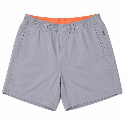 Grey Birddogs 7-inch stretch shorts with an elastic waistband, side pockets, and a bright orange interior lining.