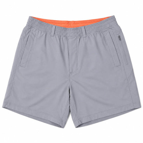 Grey Birddogs 7-inch stretch shorts with an elastic waistband, side pockets, and a bright orange interior lining.