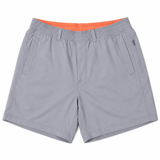 Grey Birddogs 7-inch stretch shorts with an elastic waistband, side pockets, and a bright orange interior lining.
