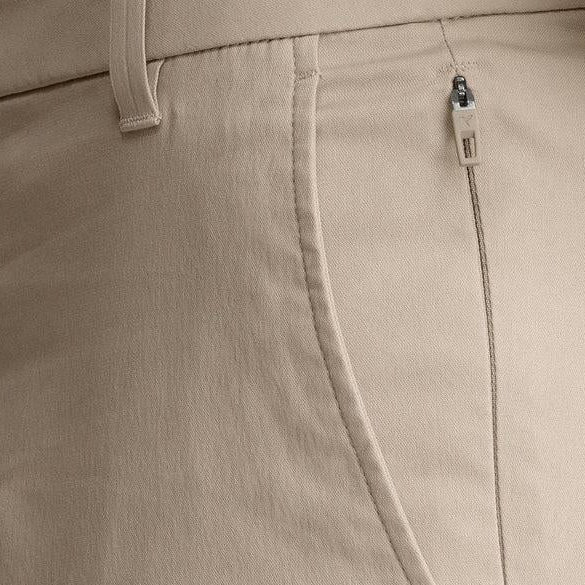 Close-up of Birddogs stretch khaki pants featuring a slim fit, durable cotton-blend fabric, and a secure zippered side pocket.