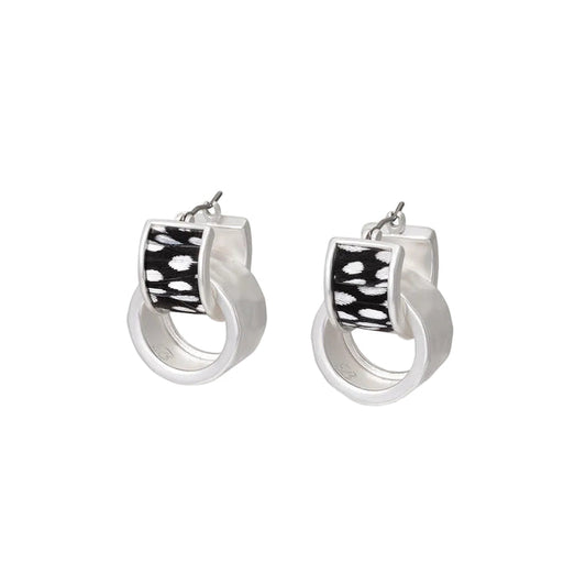 Silver-plated huggie hoop earrings featuring hand-inlaid black and white polka-dot guinea feathers.