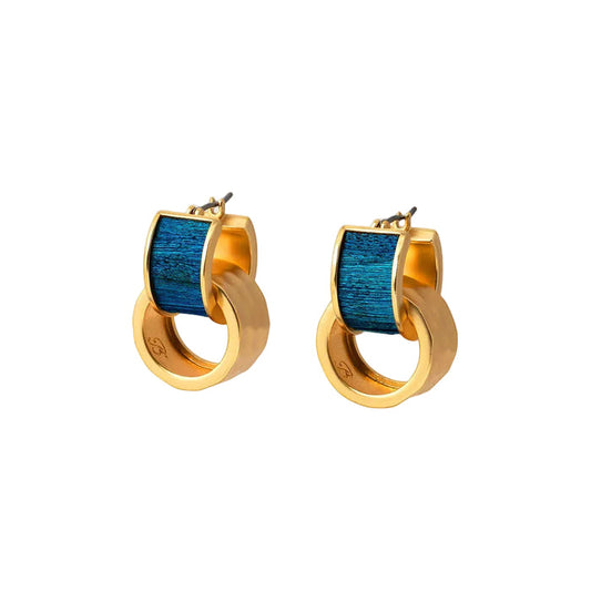 Brackish Eleuthera huggie hoop earrings featuring iridescent blue peacock feathers and removable hammered gold accents.