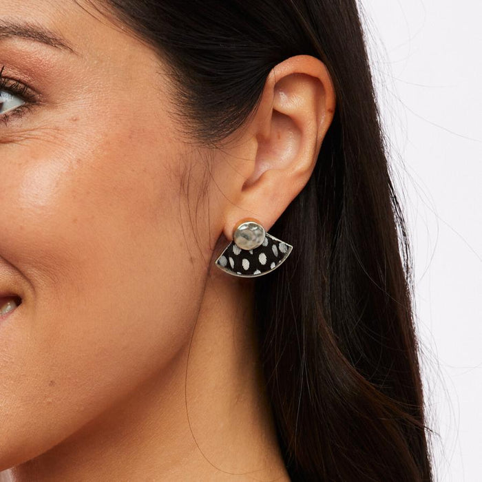 Brackish Hiott fan stud earrings featuring black and white spotted guinea feathers on a sterling silver plated brass base.