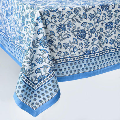 Blue and white cotton tablecloth featuring a classic Chinoiserie floral block print with a decorative border.