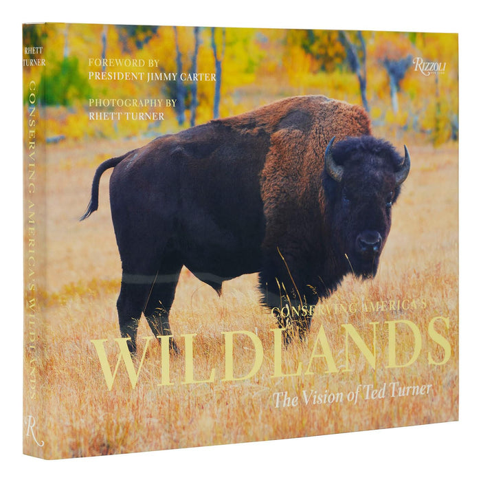 Hardcover book featuring a large American bison in a golden field on the cover, titled Conserving America's Wild Lands.