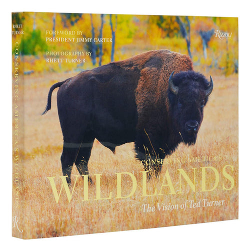 Hardcover book featuring a large American bison in a golden field on the cover, titled Conserving America's Wild Lands.