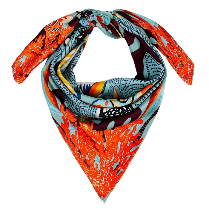 Square recycled polyester scarf featuring a vibrant coral and marine life print in blue, orange, and chocolate tones.