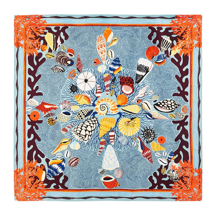 Square recycled polyester scarf featuring a coral and seashell print in blue, orange, and ochre on a navy background.