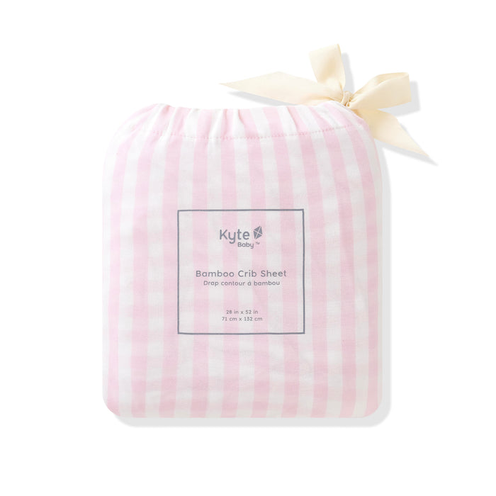 Crib Sheet in Small Sakura Stripe shown in its packaging