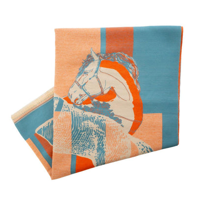 Soft acrylic equestrian wrap in orange and blue with a horse motif, featuring a large, cozy, cashmere-like design.