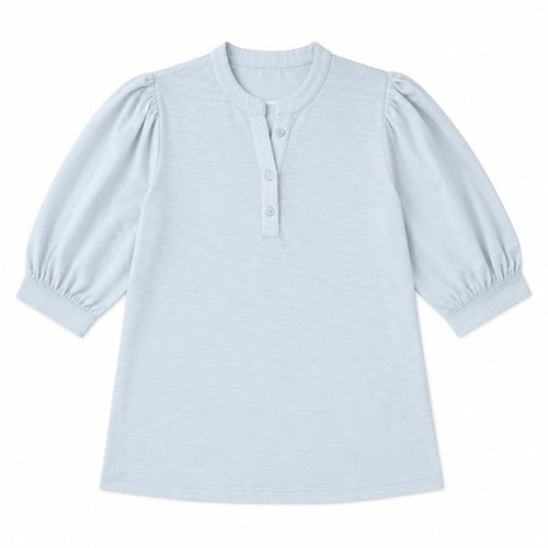 Light blue Erin Gray Kate top in soft Pima cotton with puff sleeves and a buttoned V-neckline on a white background.