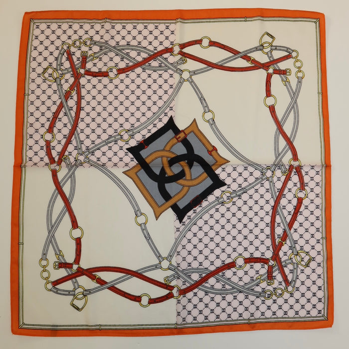 27-inch square polyester twill scarf with a vibrant orange border, equestrian belt print, and geometric logo pattern.