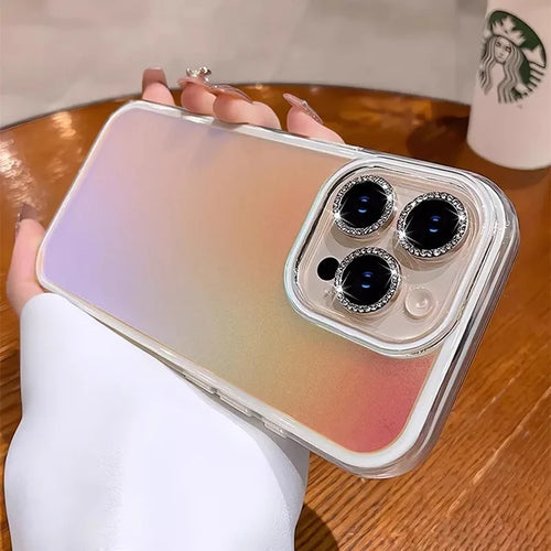 Iridescent phone case with jeweled camera lenses.