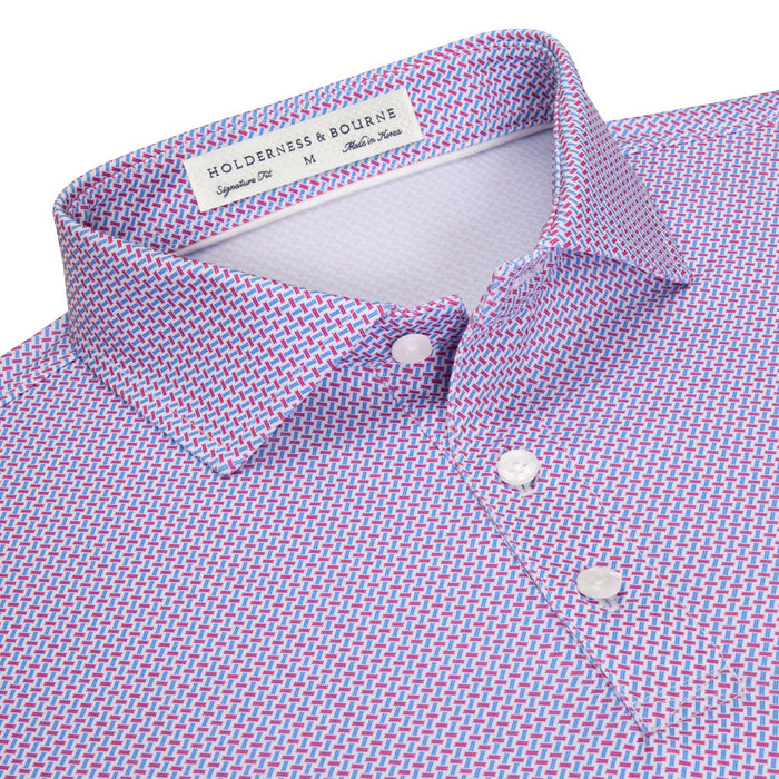Holderness & Bourne Norman polo in a blue and pink geometric basket weave print with a structured spread collar.