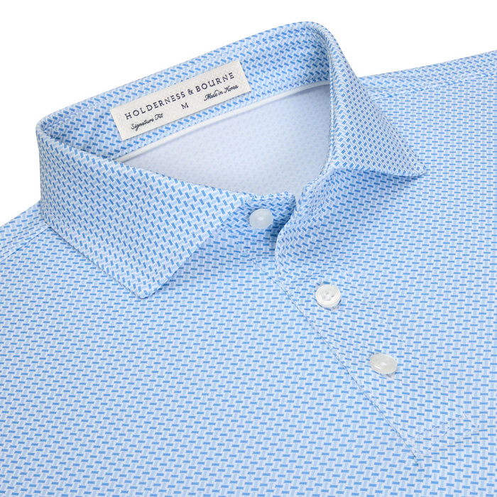 Light blue performance polo with a geometric basket weave print, structured spread collar, and three-button placket.