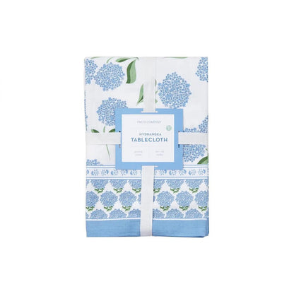 Folded 60x90 cotton tablecloth with blue hydrangea block print pattern and a decorative floral border on a white background.