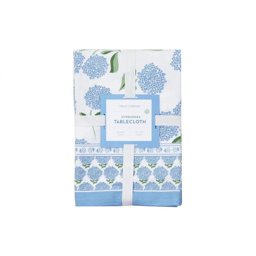 Folded 60x90 cotton tablecloth with blue hydrangea block print pattern and a decorative floral border on a white background.