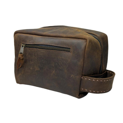 Hand-stitched brown leather Jackson Glenwood shave bag with a side handle and a zippered front pocket.