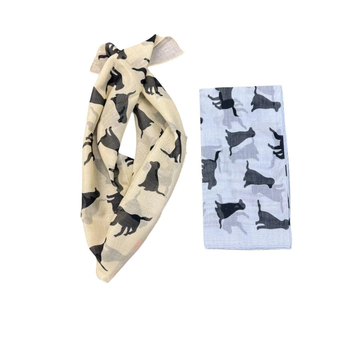 Cream and light blue cotton-cashmere bandanas featuring a repeating black Labrador silhouette pattern.
