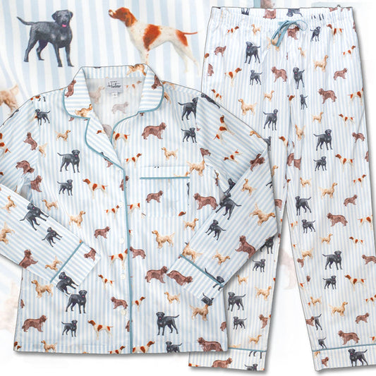 Organic cotton pajama set in pale blue stripes with a whimsical hunting dog print, featuring a button-down top and drawstring pants.
