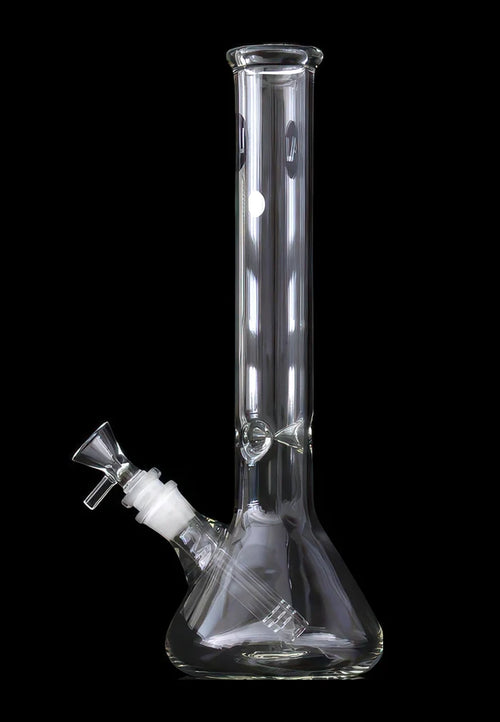 Straight-on view of a clear glass LA Pipes Standard Beaker Bong standing against a black background, showing its tall cylindrical neck, flared mouthpiece and angled downstem.