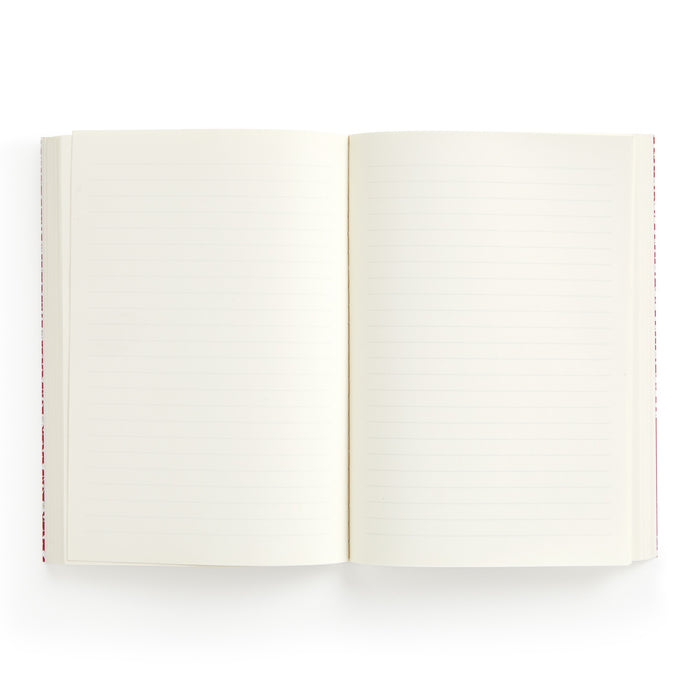 The Liberty London Liberty Nell, Annie and May Premium A5 Notebook is shown open from above, with cream-colored lined and blank pages against a white background.