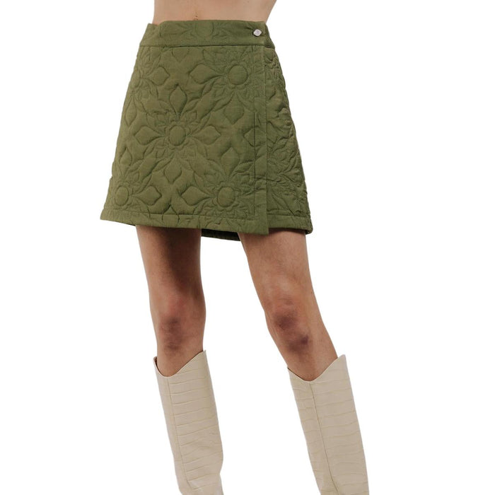 Olive green A-line quilted skirt featuring delicate floral stitching and a side button closure.