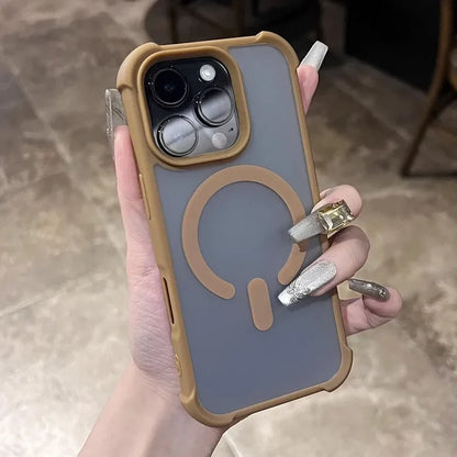 A smartphone in a translucent gray case with a tan border and a magnetic ring on the back.