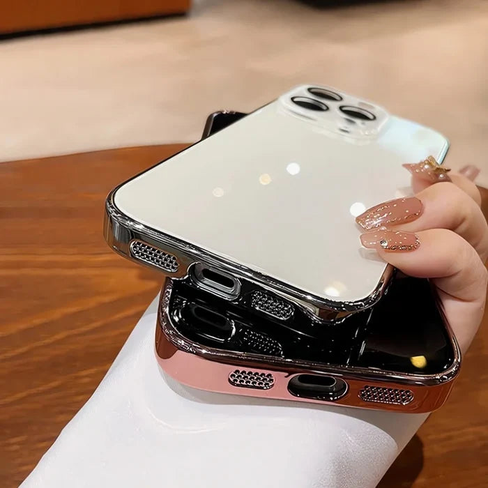 Two glossy, chrome-edged phone cases, one white and one rose gold, with precise cutouts for speakers and charging ports.