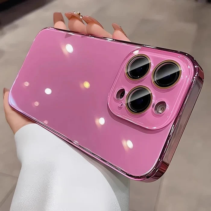 Pink reflective smartphone case with a gold-trimmed camera module.